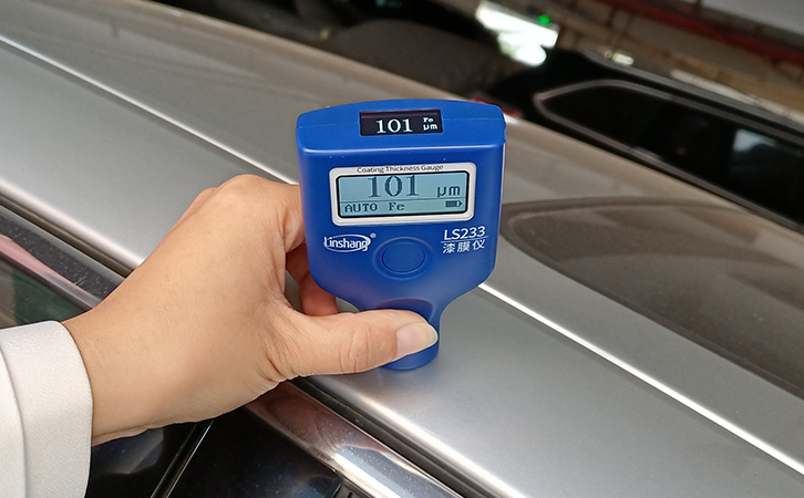 car paint meter measuring car roof